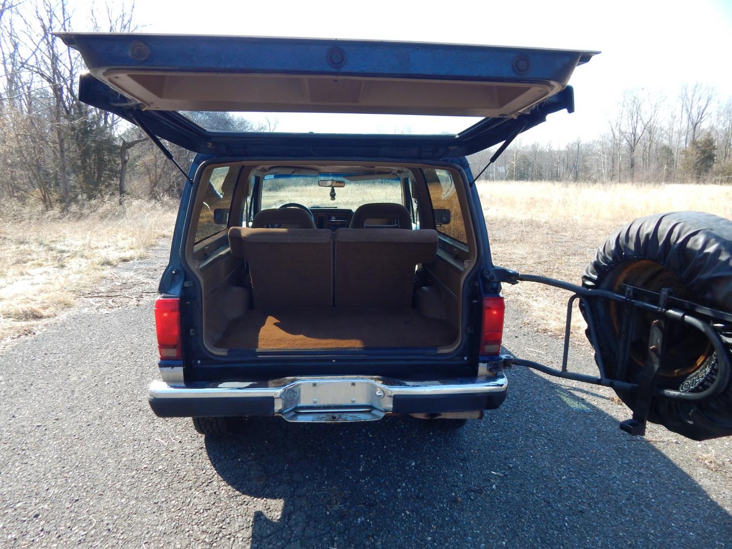 1988 Blue /Tan Ford Bronco II 4WD (1FMCU14T6JU) with an 2.9L V6 OHV 12V engine, 4-Speed Automatic Overdrive transmission, located at 6528 Lower York Road, New Hope, PA, 18938, (215) 862-9555, 40.358707, -74.977882 - Here we have a 1988 Ford Bronco 2 with a 2.9L V6 putting power to a 4x4 automatic transmission. Options include: tan cloth interior, heat/AC, XD Vision radio, power windows, cruise control, tilt steering wheel, front/rear defrost windows, spare tire cover, 15 inch alloy wheels with 4 Solarus AP tire - Photo#25